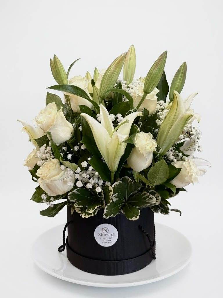 Serene Farewell - white roses and lilies in a black hat box