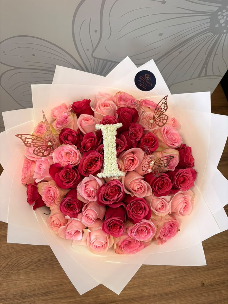 50 red and pink roses bouquet with custom floral letter I and gold butterfly accents